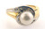 14 karat Yellow and White gold pearl and diamond ring weighing 5.4 grams. Finger size 5. Pearl is 7.0 mm/ Diamond weigh approx .25 ct tw