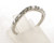 14 karat white gold diamond wedding band weighing 1.7 grams. Sz 6.25  Diamonds weigh approx .20 ct tw