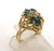 14 karat yellow gold emerald and diamond ring weighing 3.1 grams.  Finger size 2.5