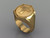 This is a smaller ring with a cross on it and plainer sides.  Weight in 14 karat yellow gold is 25 grams.