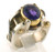 This is a custom made two tone ring featuring an amethyst bezel set in 18 karat yellow gold and two bars that cross the ring on either side of the amethyst.  Ring is a size 6.5 and weights 14.9 grams.