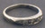 14 karat white gold diamond wedding ring weighing 2.7 grams, Diamonds weigh approx .12ct TW. Finger size 7