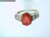 This is a 14 Karat yellow gold ring with Diamond side stones and a fire opal center stone. The Diamond TW is 0.4ct and the TW of the whole ring is 4.9 grams. The finger size of the ring is a 6.25