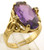 This is a 10 karat yellow gold ring with a simulated alexandrite center stone. The total weight of the ring is 4.8 grams and is made for a finger size of 6