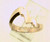 14 karat yellow gold and diamond wedding set. The diamond TW is .15ct. The total weight of both rings is 13.4 grams and is made for a finger size of 6. *Center stone sold separate*