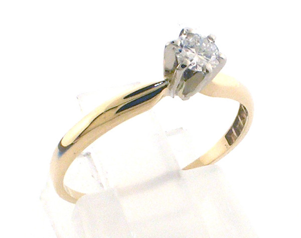 14 karat yellow gold diamond engagement ring weighing 1.2 grams.  Finger size 7  Diamond weighs .18ct I-J, SI1