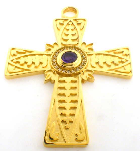 CAD designed pectoral cross with leaf designs. Amethyst center stone is surrounded by daimonds. 3.5 Inches in height. In 14k gold, cross weighs 58.6 grams.