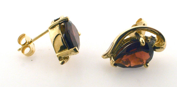 14 karat yellow gold garnet and diamond earrings weighing 4.4 grams