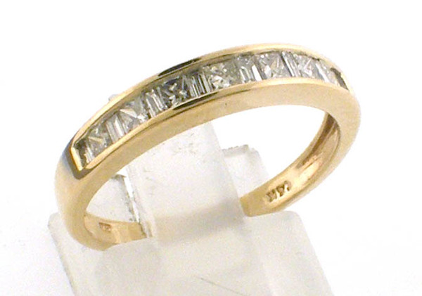 14 karat yellow gold diamond wedding band. Alternating princess cuts and baguettes.  Total diamond weight approx .50ct.  Ring weighs 2.4 grams.   sz 7.75