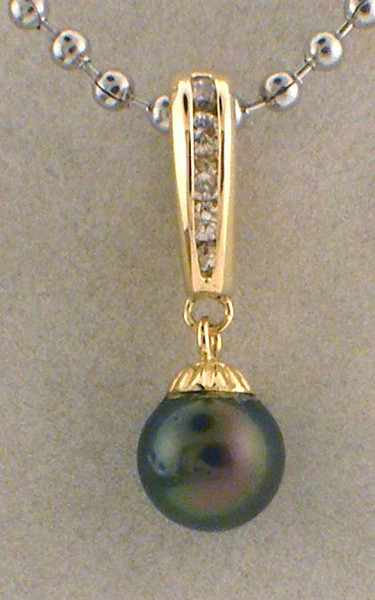 14 karat yellow gold diamond and black pearl pendant weighing 2.5 grams.  Pearl is 8.2mm. Diamonds weigh approx .15ct tw