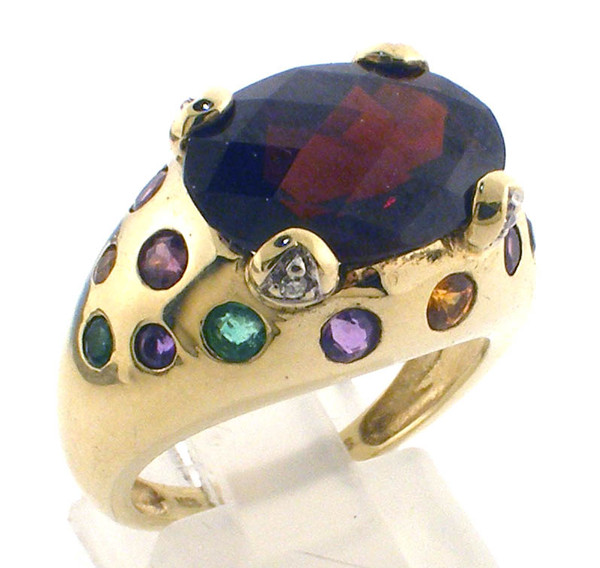 10 karat yellow gold 14x10 checkerboard garnet and multi color stone ring weighing 7.3 grams.  Finger size 7.25