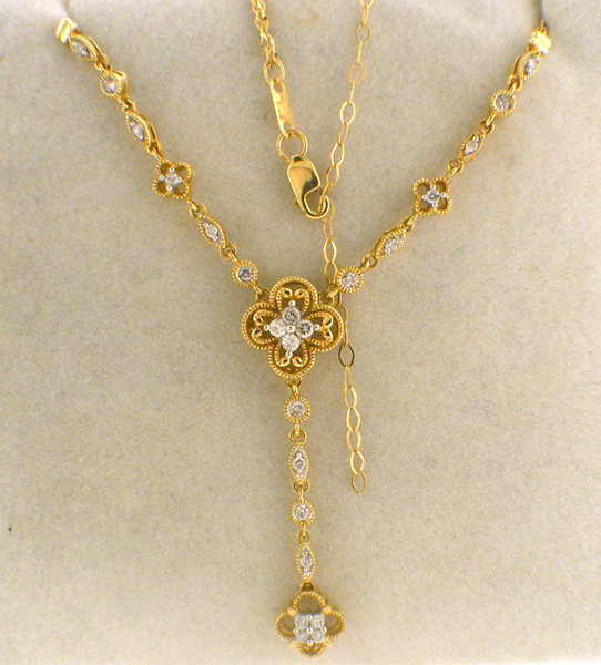 14 karat yellow gold diamond necklace 17 inches weighing 6.5 grams.  Diamonds weigh approx.33ct tw