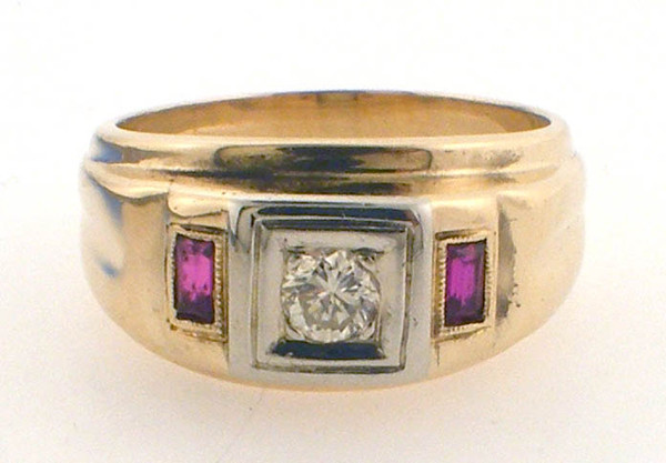 14 karat yellow gold mens diamond and ruby ring weighing 8.8 grams.  Finger size 9. Diamond weighs approx .20ct