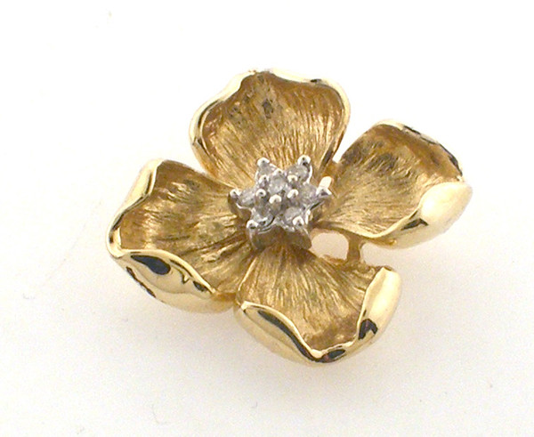 14 karat yellow gold flower pendant with diamonds and hidden bale.  Pendant weighs 3.7 grams