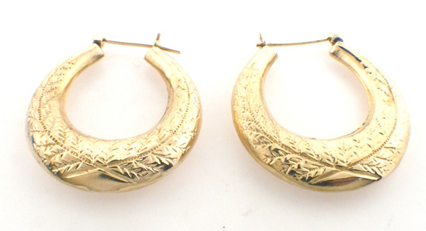 14 karat yellow gold engraved hoop earrings weighing 5.0 grams.  Price reduced for slight dent in one earring