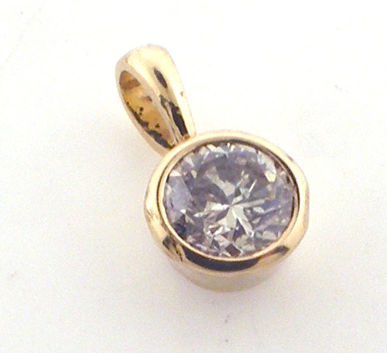 14 karat yellow gold bezel set solitaire diamond pendant weighing .8 grams. Diamond is approx .75ct tw.  I-J color / SI2 clarity