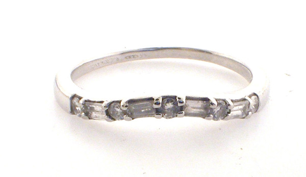 14 karat white gold diamond wedding band weighing 1.7 grams. Sz 6.25  Diamonds weigh approx .20 ct tw