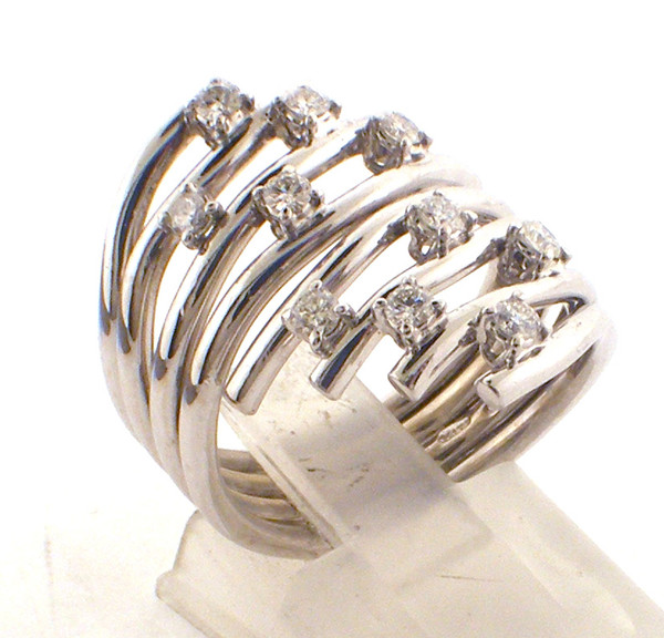 14 karat white gold wide bypass diamond ring weighing 10.7 grams. Finger size 7 3/4.  Diamond weight ~.25ct tw