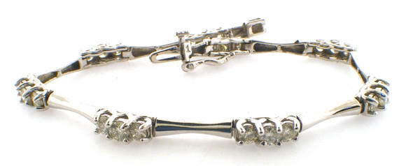 14 karat white gold 7 inch diamond bracelet weighing 10.4 grams.  Diamonds weigh a total of approx 2.40 carats tw