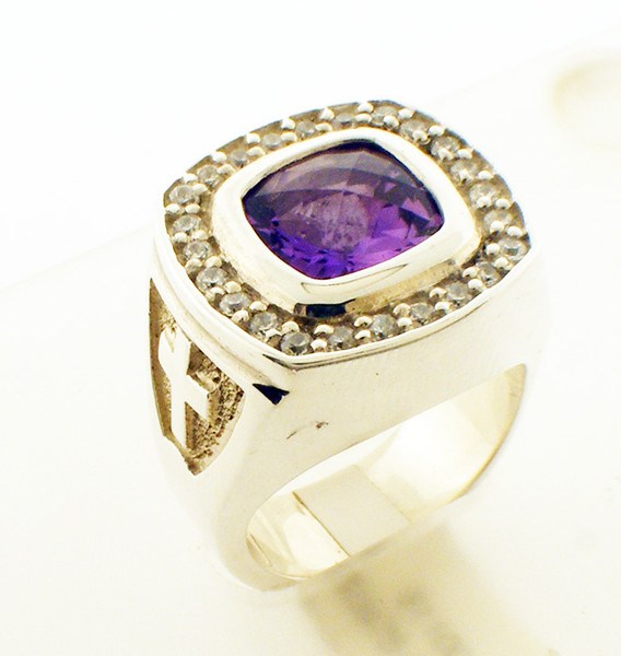 This is a Episcopal Ring with an Antique Cushion Cut Amethyst center stone.  It comes surrounded by diamonds which total 50/100 of a carat in weight or a braid instead than the diamonds.