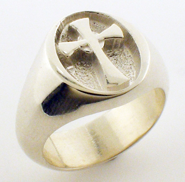 Smaller version of BR140  Concave center with cross.  Ring is 14 x 12mm and weighs 12.75 in 14 karat yellow gold.