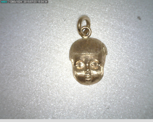 14 karat yellow gold boy head charm weighing 2.7 grams