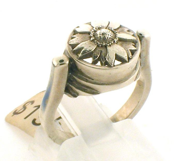 This is a custom designed sterling silver sunflower ring.  Sunflower top is 12 x 12mm round.  Ring is a size 5.5 and weighs 6.6 grams.