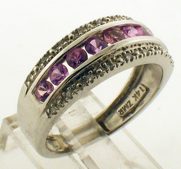 This is a 14 karat white gold ring with Pink sapphire and Diamonds. The total weight of the ring is 2.9 grams and is for a finger size 6.