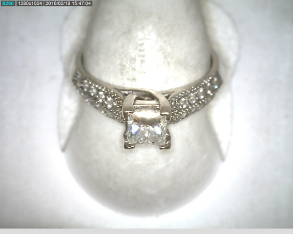 14 karat white gold diamond engagement ring weighing 3.4 grams.  Center diamond is a .57ct princess cut G, VS, Finger size 5