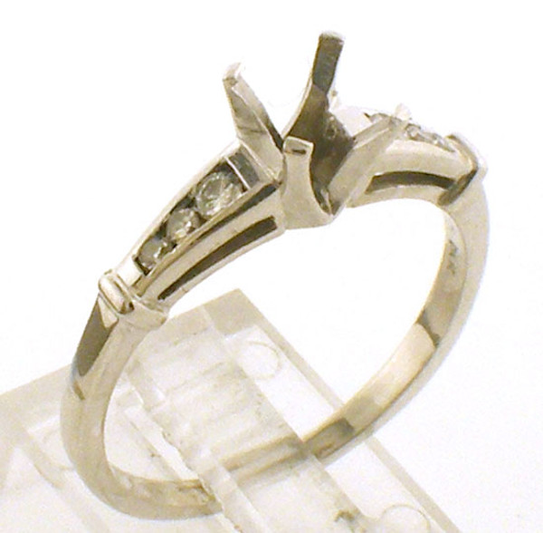 14 karat white gold semi mount ring to take a 6.0mm center stone. Finger size 7.5, Diamonds weigh approx .12ct tw.