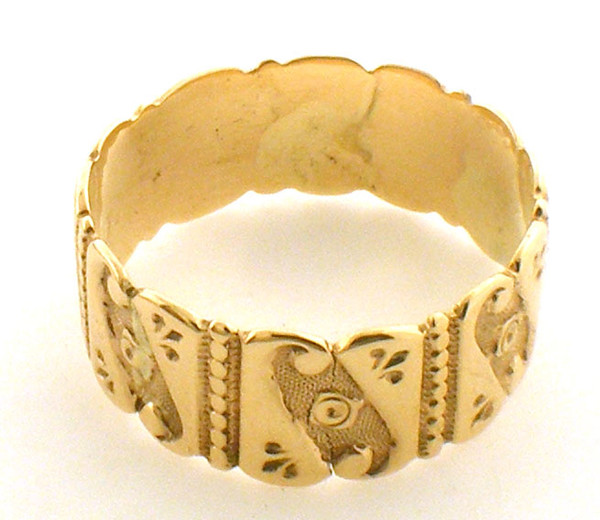 This is an ornate 10 karat yellow gold ring. The total weight of the ring is 2.8 grams and is made for a finger size of 8.25