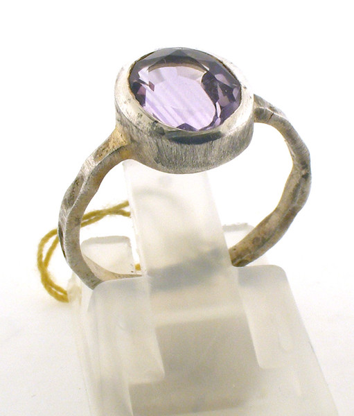 Sterling silver and light purple colored stone ring. The total weight of the ring is 2.1 grams and is made for a finger size of 6.