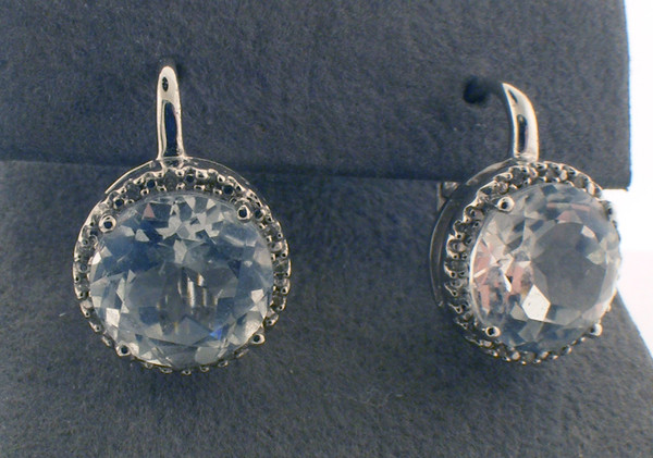 Sterling silver diamond and white topaz stud earrings. The total weight of the earrings are 5.6 grams.