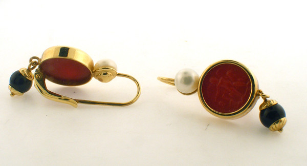 14 karat yellow gold black and white pearl and red stone earrings. The total weight of the earrings is 5.0 grams.