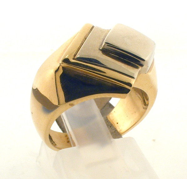 14 karat gold two tone ring. The total weight of the ring is 13.9 grams and the ring is made for a finger size of 6.75.