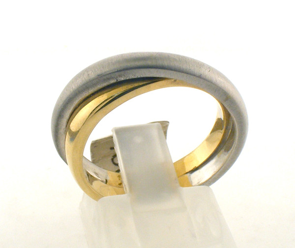 14 karat gold two tone overlapping ring. The total weight of the ring is 7.2 grams and is made for a finger size of 7.25.