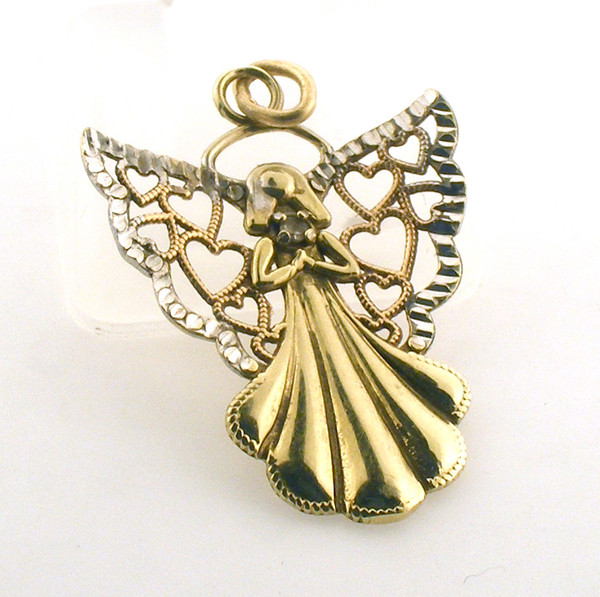 10 karat gold and diamond angel. The total weight of the piece is .5 grams. This could be used as a pendant or charm.