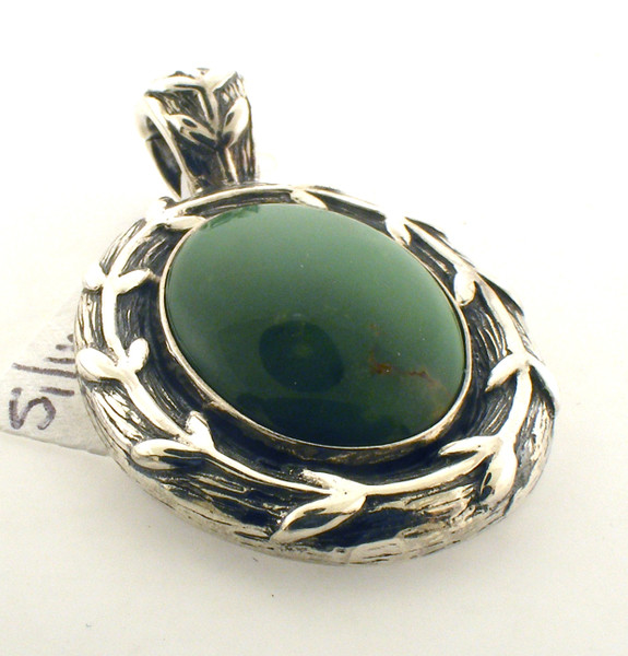 Sterling silver and green stone pendant. The total weight of the pendant is 9.9 grams.