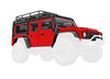 Body, Land Rover® Defender®, complete, red (includes grille, side mirrors, door handles, fender flares, fuel canisters, jack, spare tire mount, & clipless mounting)
