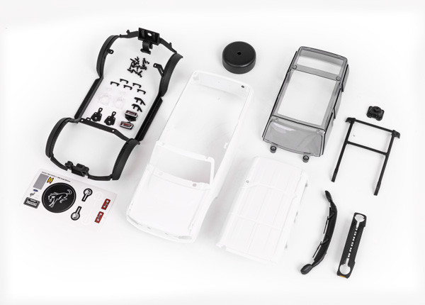 Body, Ford Bronco, complete (unassembled) (white, requires painting) (includes grille, side mirrors, door handles, fender flares, windshield wipers, spare tire mount, & clipless mounting)
