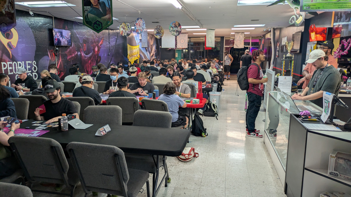 Players enjoying trading card game events at The People&rsquo;s Card Shop in Las Vegas, featuring a welcoming community and competitive environment near the Strip.