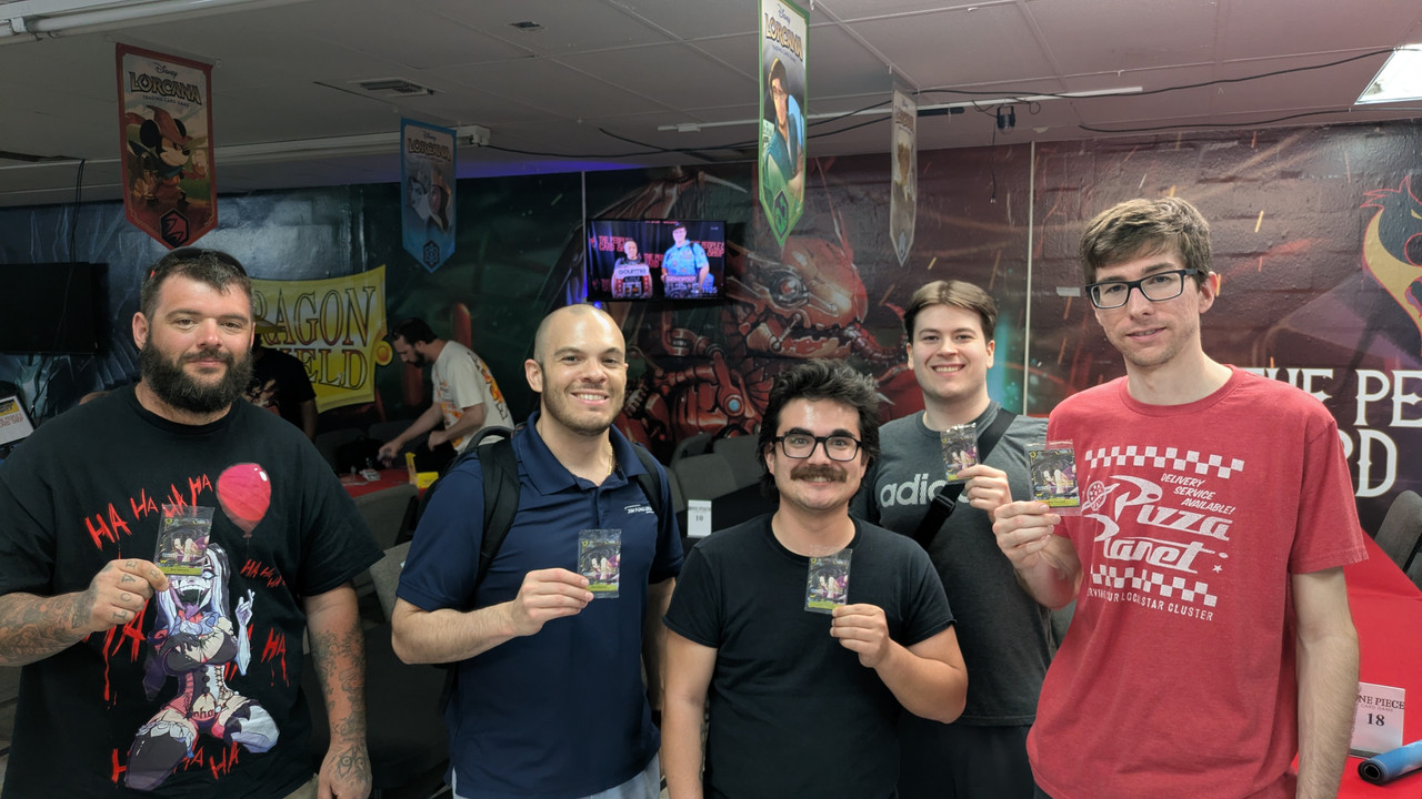 One Piece Tournament Winners Las Vegas One Piece Card Game tournament winners holding prizes at The People's Card Shop in Las Vegas
