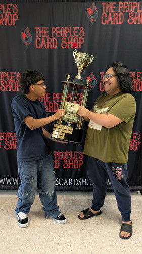 Yu-Gi-Oh! tournament winner at The People’s Card Shop in Las Vegas holding championship trophy