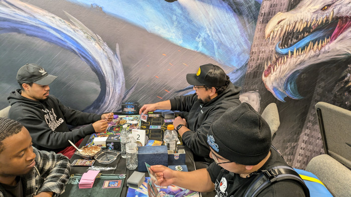 Duelists playing Yu-Gi-Oh! at a Las Vegas card shop during a weekly locals event