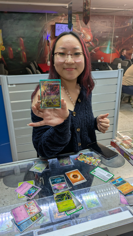 Pokémon Singles at The People's Card Shop Las Vegas Pokémon player showing off a Mega Gengar GX card at The People's Card Shop in Las Vegas