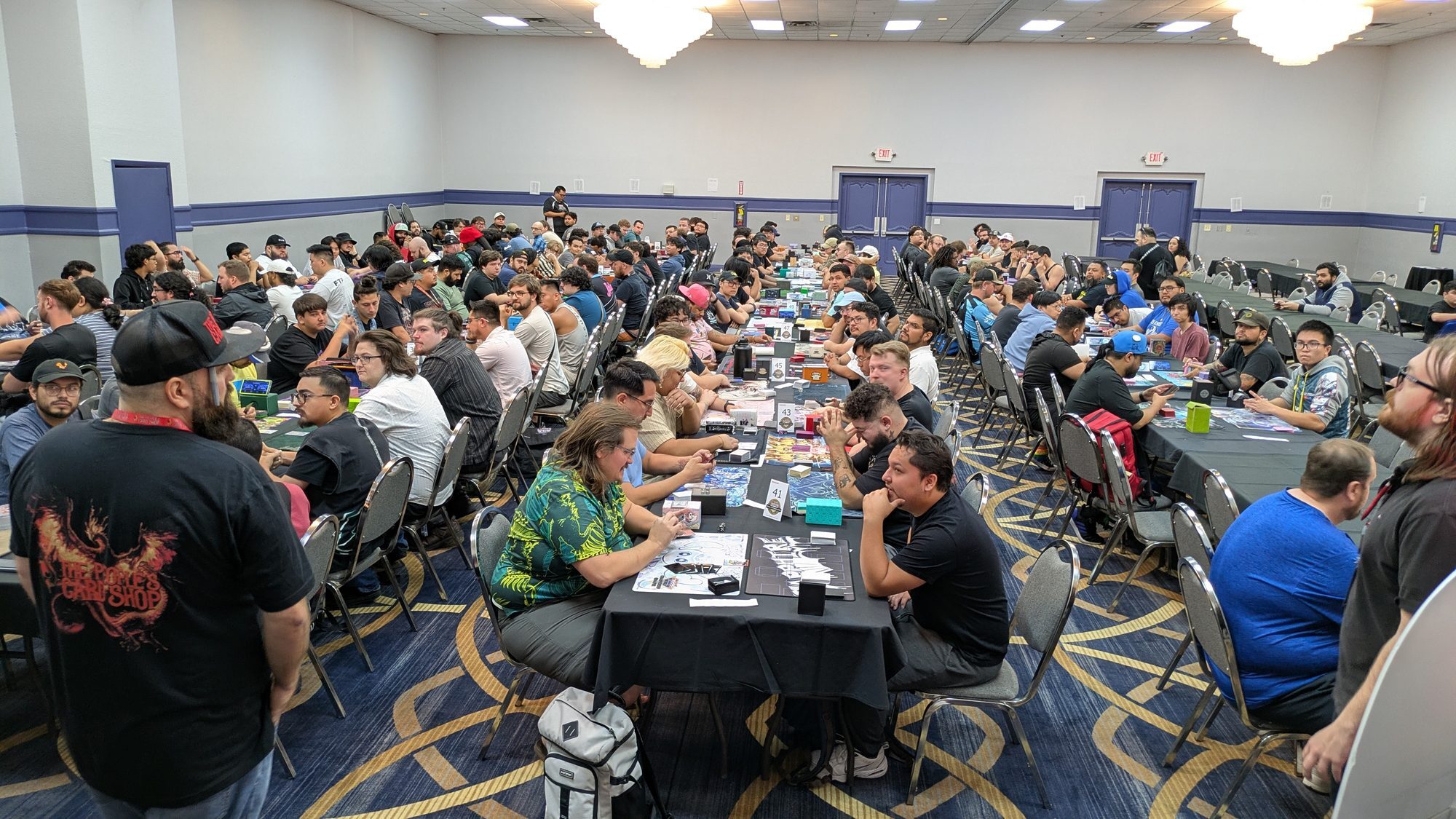 Duelists at numbered tables during a Yu-Gi-Oh! Regional tournament in Las Vegas