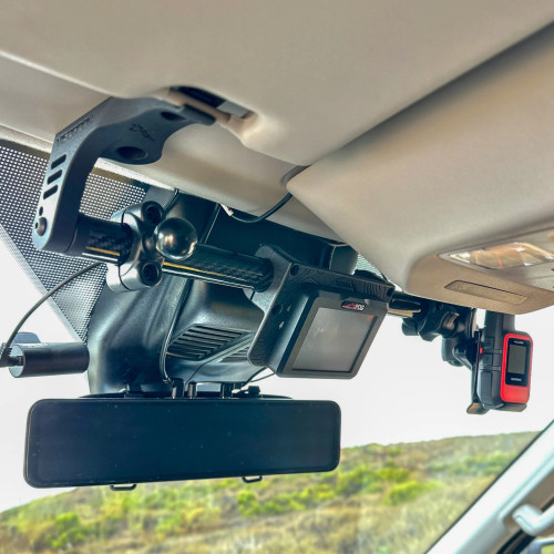 Visor Mount for Transit vans attached above the windshield with mounted devices and camera.
