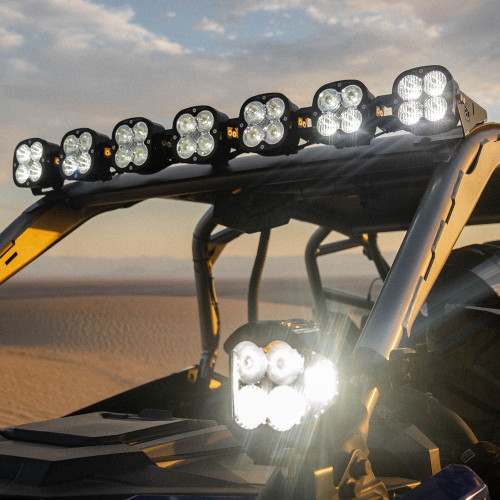 The Baja Designs 7-XL Linkable on the roof of a Polaris RZR Pro R UTV at dusk on top of a sand dune.