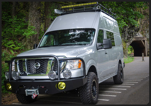 A white Nissan NV van with a black powder coated off-road front winch bumper from Aluminess Products.