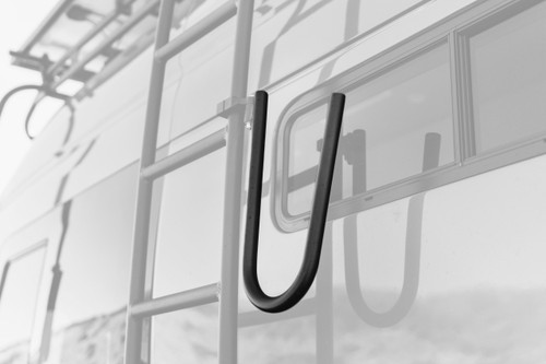 Close-up picture featuring Aluminess Side Surf Hooks on a dark van.